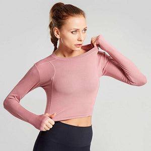 Active Crop Top in pink, long sleeves, ideal for workouts and casual wear.