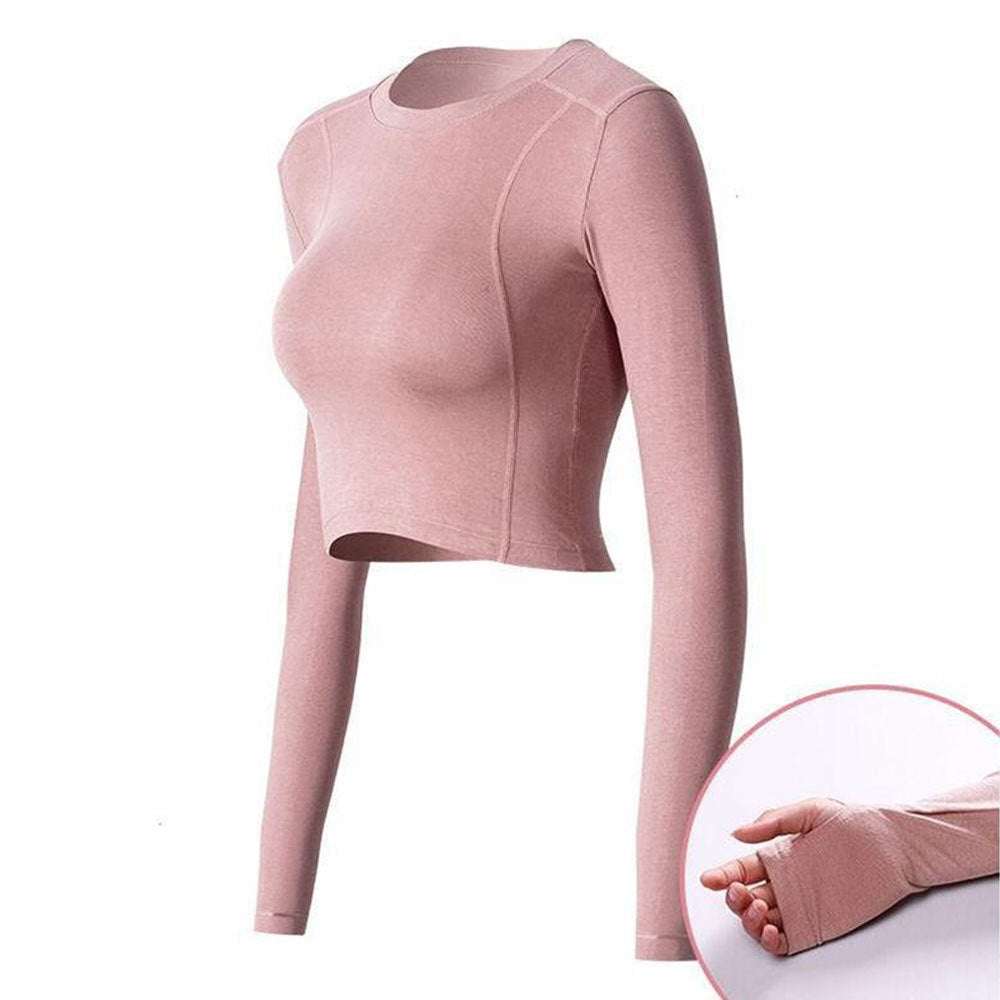 Long sleeve pink active crop top with thumbholes, designed for workouts and casual wear.