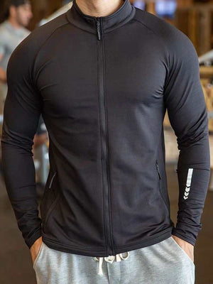 Black active jacket with dual zipper pockets and a sleek, unisex design for versatile use.