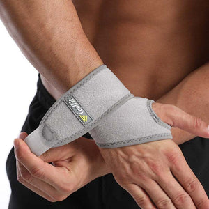 Gray Active Wrist Support being worn for enhanced stability and injury prevention.