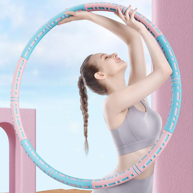 Woman exercising with a Classic Exercise Hoop in pastel colors, outdoors.