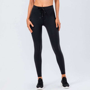 Women's black leggings with adjustable waistband, perfect for workouts or lounging.