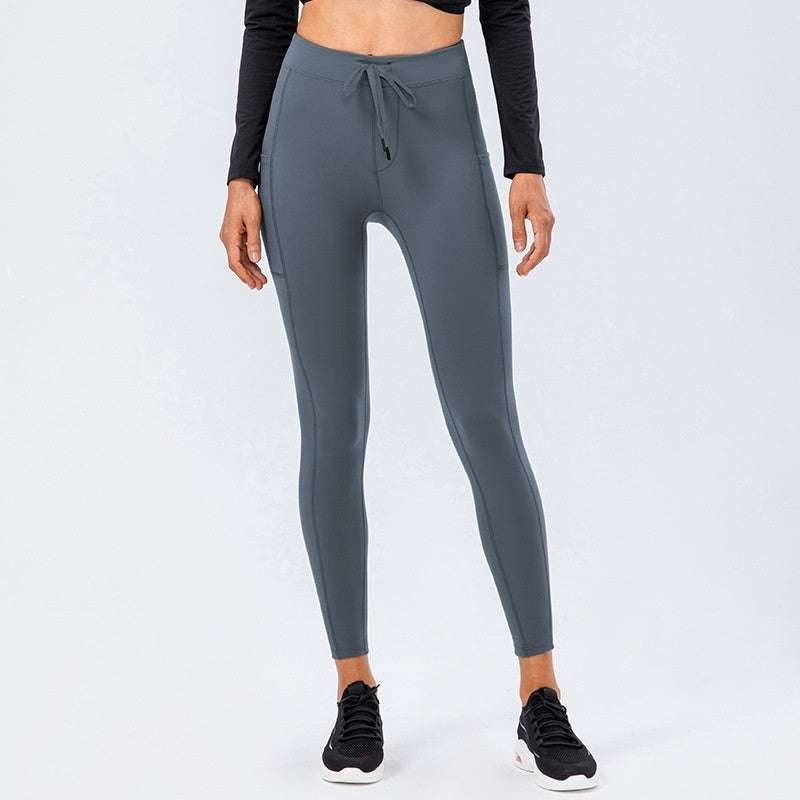 Women's comfy leggings in gray with adjustable waistband and side pocket.