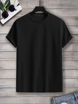 Black Comfy Shirt with patterned design hanging on wooden background.