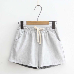 Comfy Shorts in light gray with adjustable drawstring waist, breathable cotton, and pockets for everyday comfort and style.