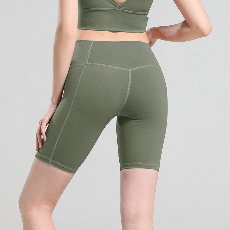 Olive green yoga shorts, comfortable fit for exercise and casual wear.