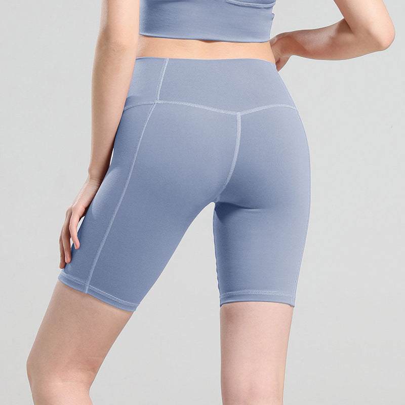 Women's comfy yoga shorts in light blue, featuring a high-waist design and breathable cotton fabric. Perfect for workouts and casual wear.