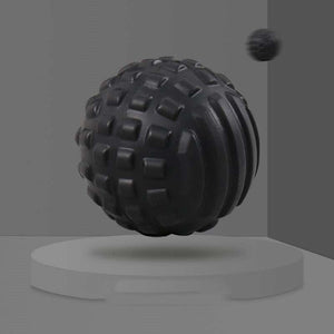 Textured black massage ball for deep tissue relief and relaxation.