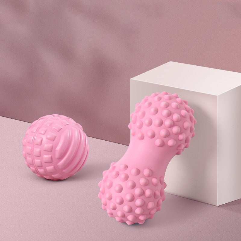 Pink enhanced massage balls with textured surfaces for muscle relief, featuring classic and peanut designs.