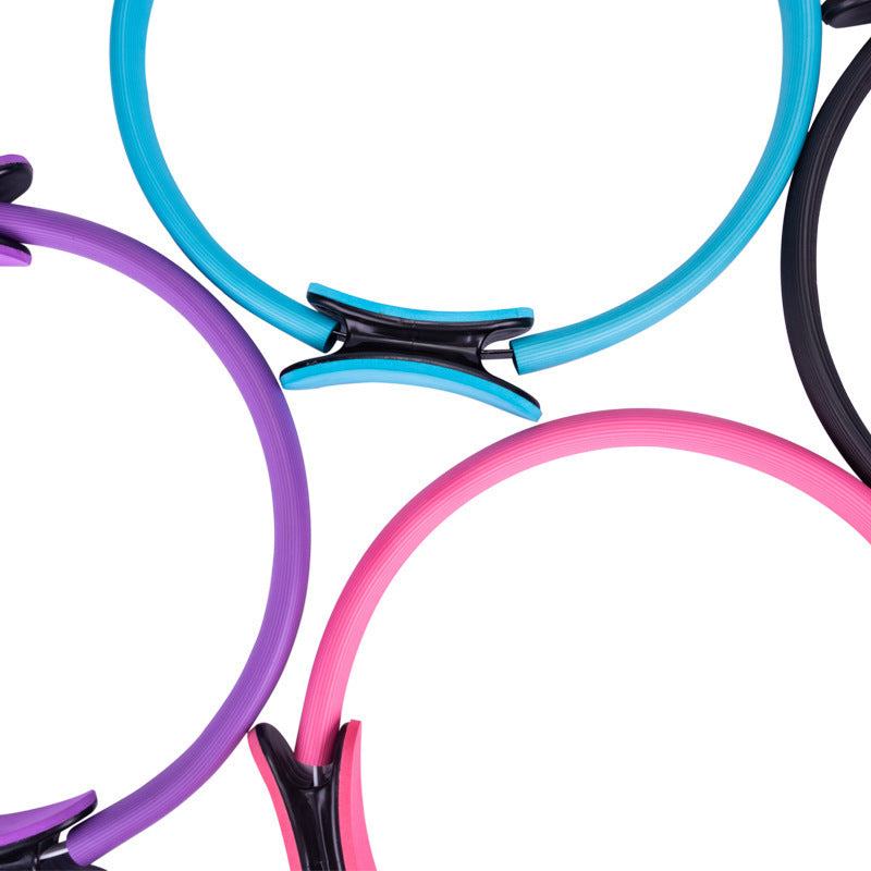 Colorful exercise rings with stable grip handles, ideal for yoga and pilates workouts.