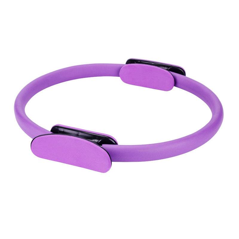 Purple exercise ring with stable grip handles for yoga and pilates workouts.