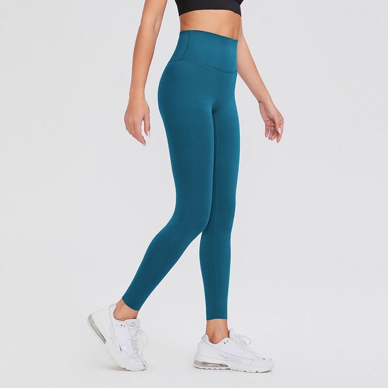 High waist leggings in vibrant teal, offering comfort and tummy control for workouts or casual wear.