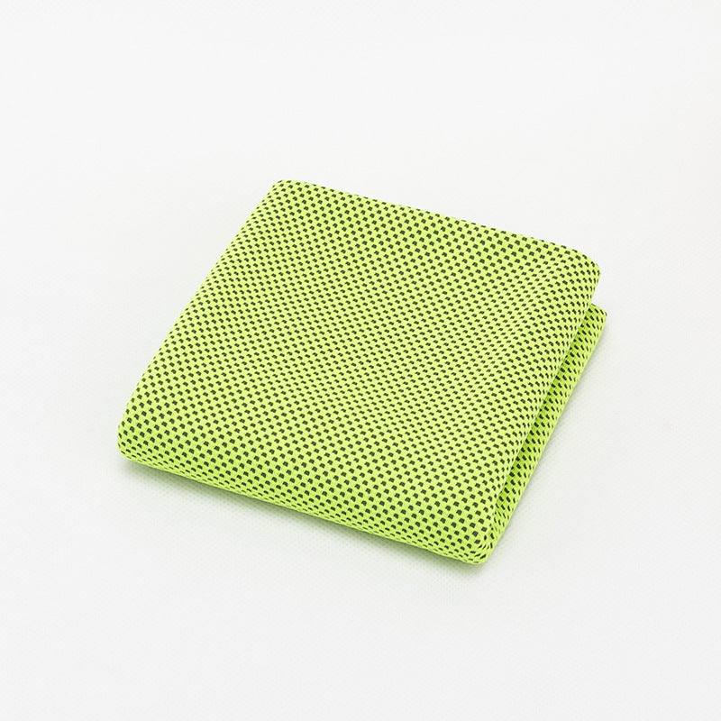 Large green sports towel folded on a white background.