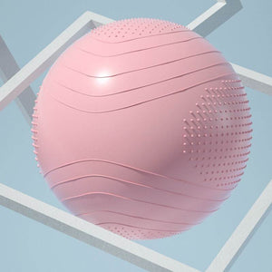 Large pink yoga ball with textured surface and anti-slip grip for fitness exercises.