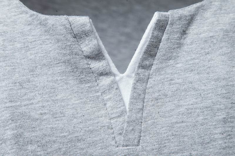 Close-up of a soft, breathable cotton loose-fit shirt in grey.