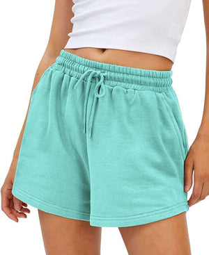 Loose Fit Shorts in turquoise with drawstring waist and pockets, made from quick-drying, breathable fabric.