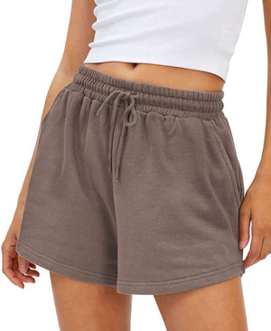 Loose fit shorts in a neutral color with an elastic drawstring waist, perfect for comfort and style.