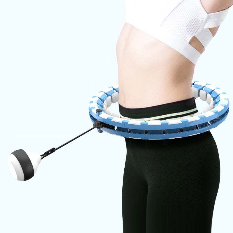 Woman using Modern Exercise Hoop with adjustable weight ball for a fun and effective workout.