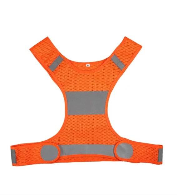 Night reflective safety vest in bright orange with reflective straps.