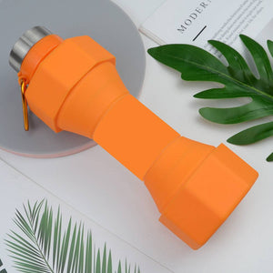 Orange silicone sports bottle with a dumbbell design, collapsible for easy storage, BPA-free, and ideal for cold drinks.