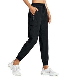 Black snug fit pants, adjustable waistband, secure pockets, comfortable and stylish for workouts or casual outings.