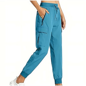 Teal snug fit pants with adjustable waistband and zipper pockets.