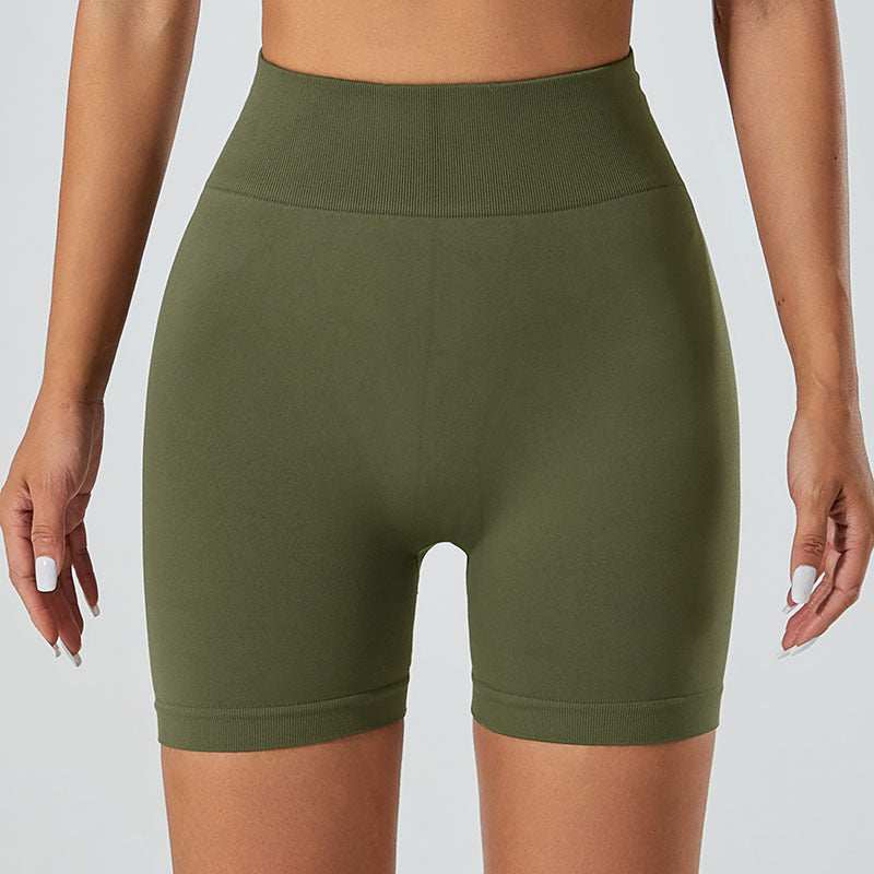 Olive green snug fit yoga shorts with high waistband for comfort and style.