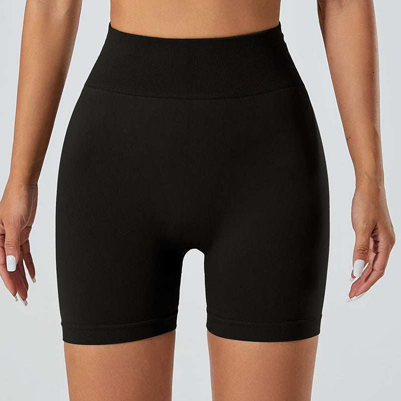 Black snug fit yoga shorts for women, featuring a high waistband and form-fitting design ideal for workouts.