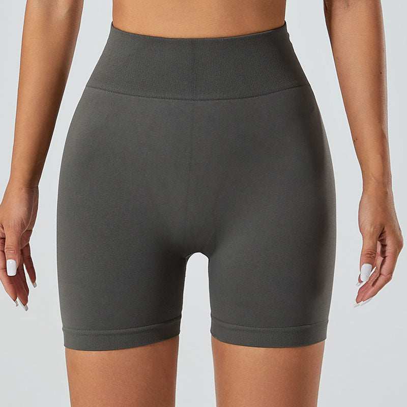 Women's snug fit yoga shorts in dark gray, featuring a high-waist design for comfort and style.