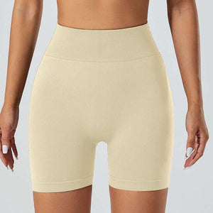 Women's snug fit yoga shorts in beige, featuring a high-waist design and smooth finish, ideal for workouts or casual wear.