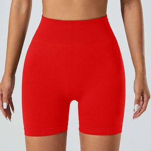 Red snug fit yoga shorts offering breathable comfort, quick-drying fabric, and versatile style for yoga and active lifestyle.