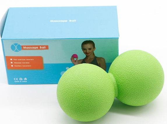 Green standard massage ball with packaging, designed for muscle tension relief and portability.