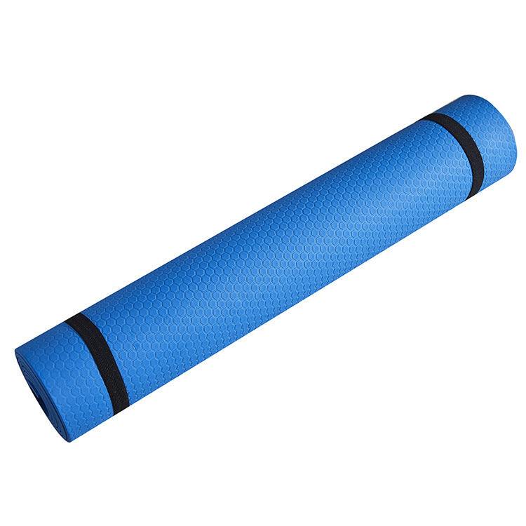 Blue standard yoga mat with non-slip honeycomb design, rolled and ready for use in various exercises.