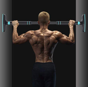 Man demonstrating the Strong Pull-Up Bar in a doorway installation.